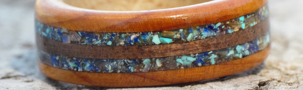Wooden Rings inlaid with semi-precious gemstones and other inlays.
